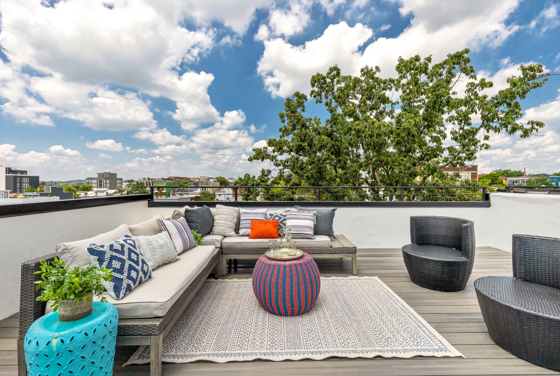 Cozy rooftop lounge with colorful decor